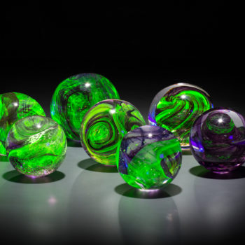 Etusko Ichikawa, Leaving a Legacy, Orb Installation, 2018, Hot sculpted glass with uranium, 40 x 40 x 42 inches